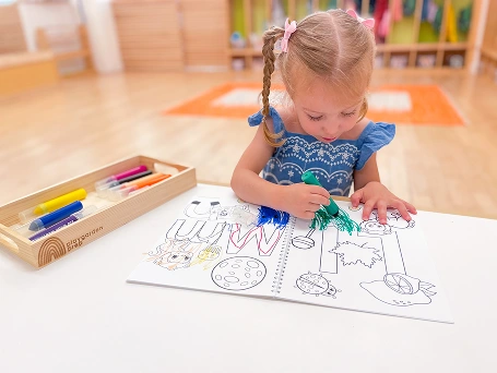 Child drawing at a table